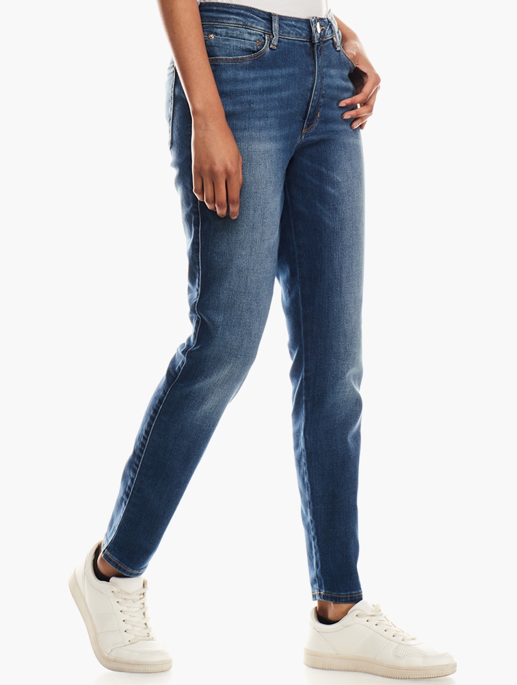 Shop GUESS Mid Wash Savv Sexy Curve Denim Jeans for Women from MyRunway ...